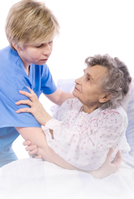 caregiver helping old woman